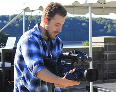 Image of MCTV student with a camera