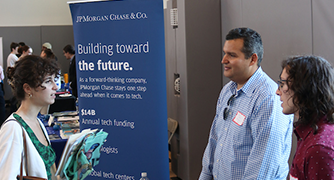Image of Marist University student talking with JPMorgan employees.