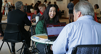 image of student talking with a professor