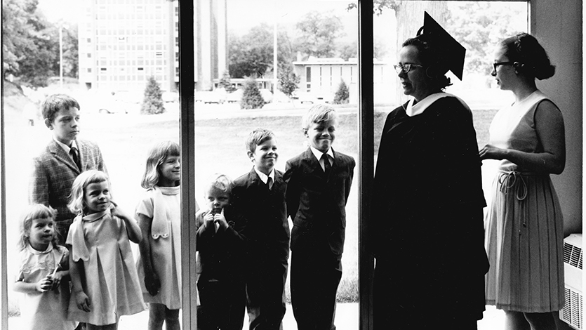 Dorothy Willis '68 graduates as her children look on