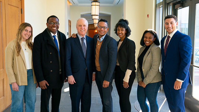 Image of Edward Summers with President Murray and students on the Marist campus
