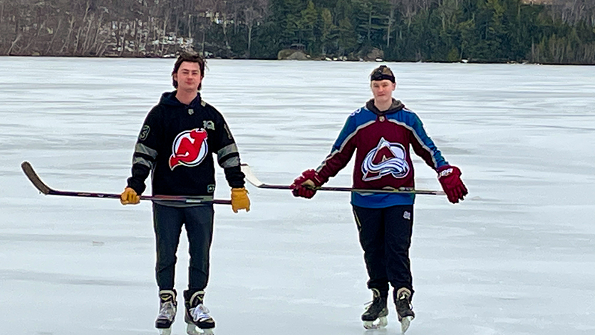 image of Alex and Brooke Weinman on the pond, a familiar sight