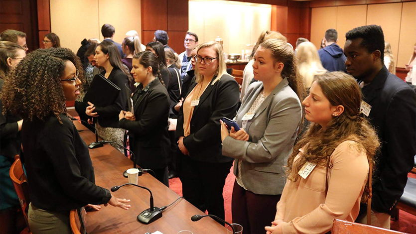 Vanadia (far left holding folder) networking with Marist Alumni on the D.C. Public Service Career Trip in 2019. 