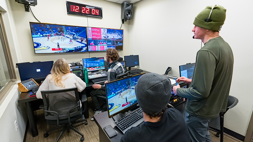 Image of students in control room producing live athletics events.