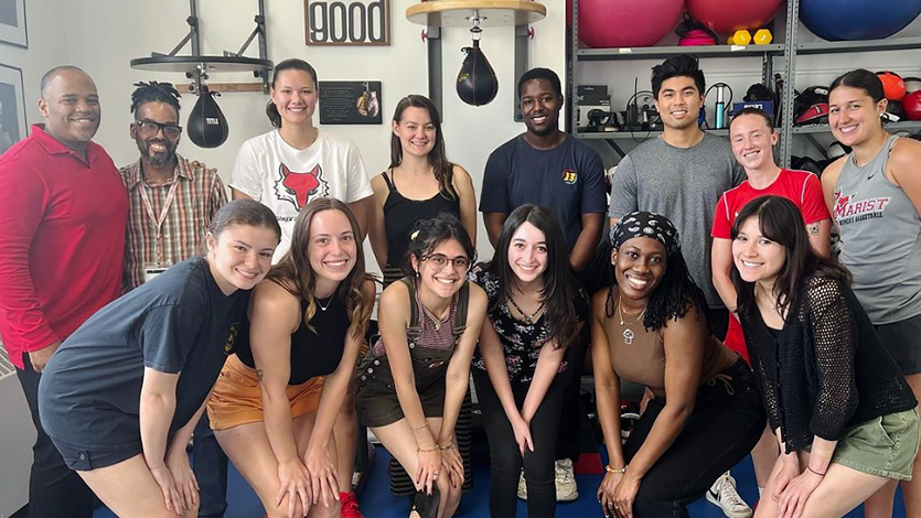 Image of Merene Budu-Smith Otoo ’24, bottom row and second from right, poses with her Finish Strong Wellness Center colleagues during her internship.