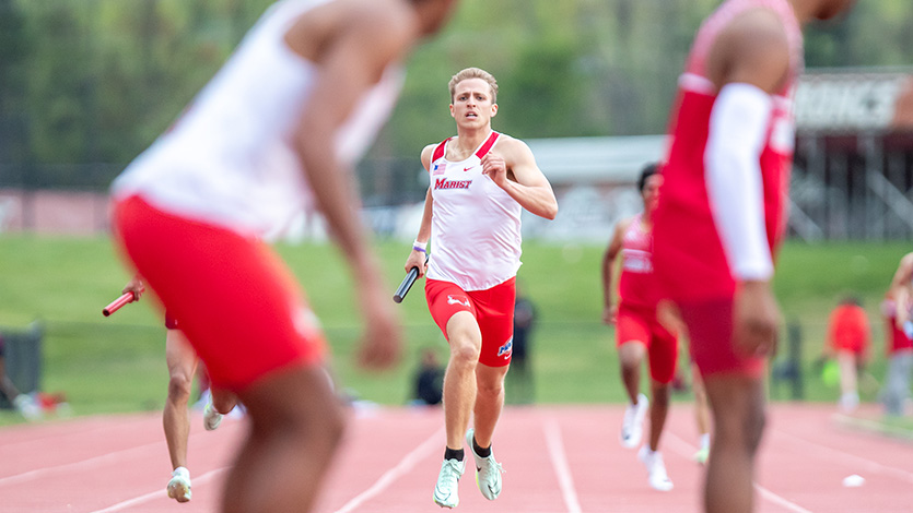 Image of Marist track athletes competing in a relay event.