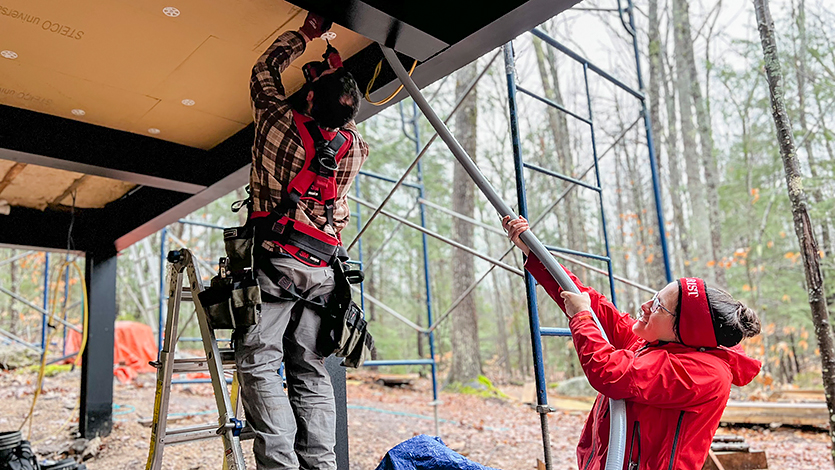 Image of Heidi and Nicholas working on construction of the treehouse.