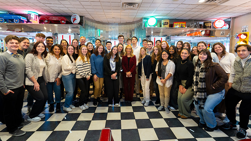 Image of CNN's Dana Bash with students in group photo.