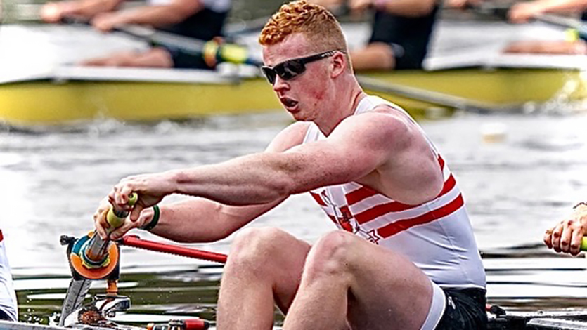 Image of Cooper Hite rowing for the Marist crew team during a competition. 