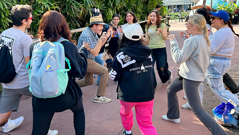 Image of the attachment class doing team-building exercises in Disney World.