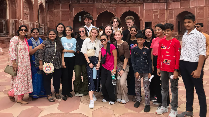 Image of ASAP ’23 students interact with other visitors at the Taj Mahal. 