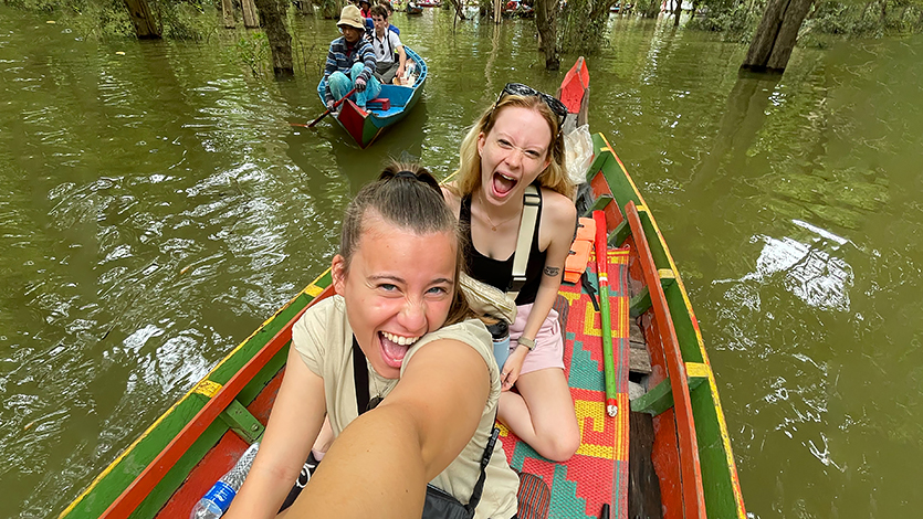 Image of Veronica Vogelman ‘26 and Elizabeth Granholm ’25 tour the Floating Village Kamplong Pluk, Cambodia.