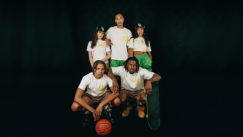 Image of Javon (bottom right) and friends modeling Chain Reaction apparel in the MakerLabat Marist Steel Plant.