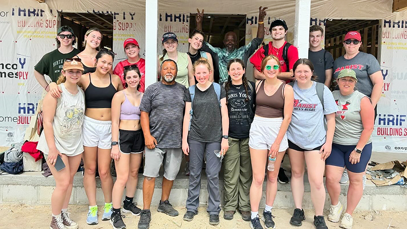 Image of students outside Habitat for Humanity house project.