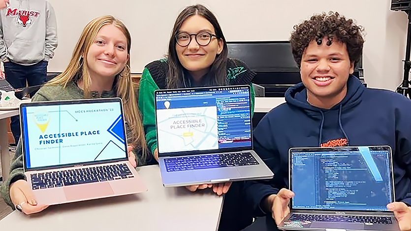 Image of Karina and other students at Hackathon 