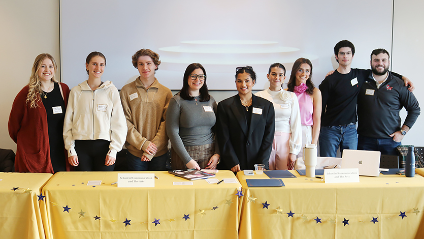 Image of student table hosts at the Internship Showcase.