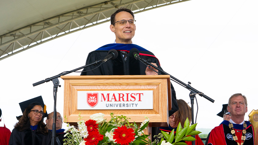 Image of Steve Kornacki addressing graduates at commencement.
