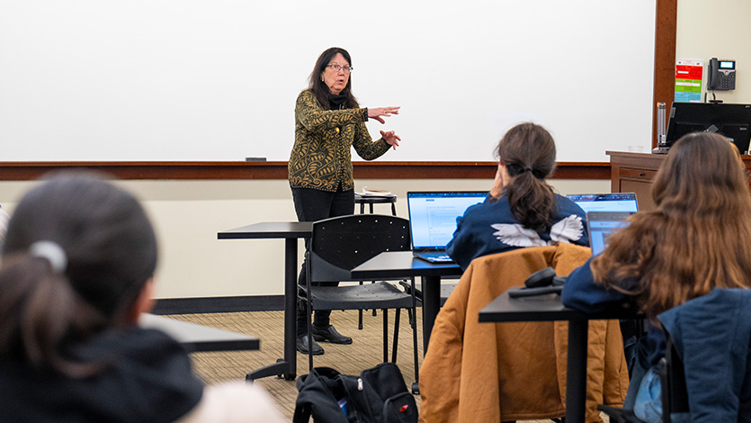 Image of Joan Murray speaking to a class.