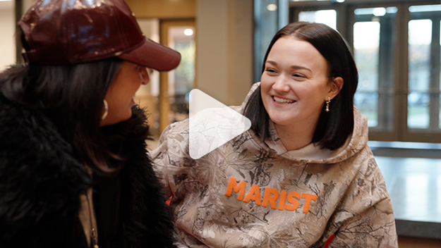 Image of Noelle Stamm with "play" icon.