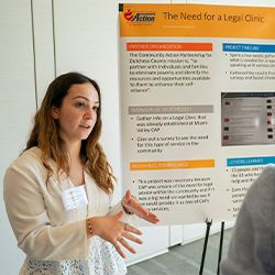 Image of Marist student presenting a research poster.
