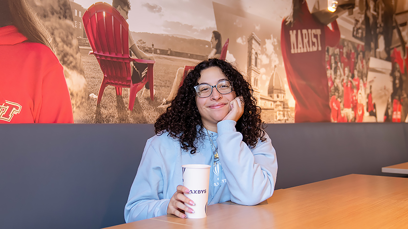 Image of Liana Perez sitting in Saxbys.