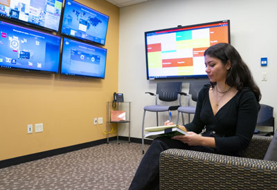 Image of student conducting research in the Center for Social Media.