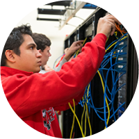 Image of a student working in a networking lab.