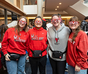Marist University image: students wearing Marist glasses at university day.
