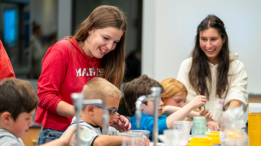 Image of Marist education students engage young learners in hands-on science activities. Photo by Bobby Oliver/Marist University.
