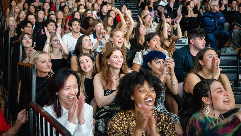 Image of Senior designers cheer on their classmates’ collections at the show. Photo by Nelson Echeverria/Marist University.