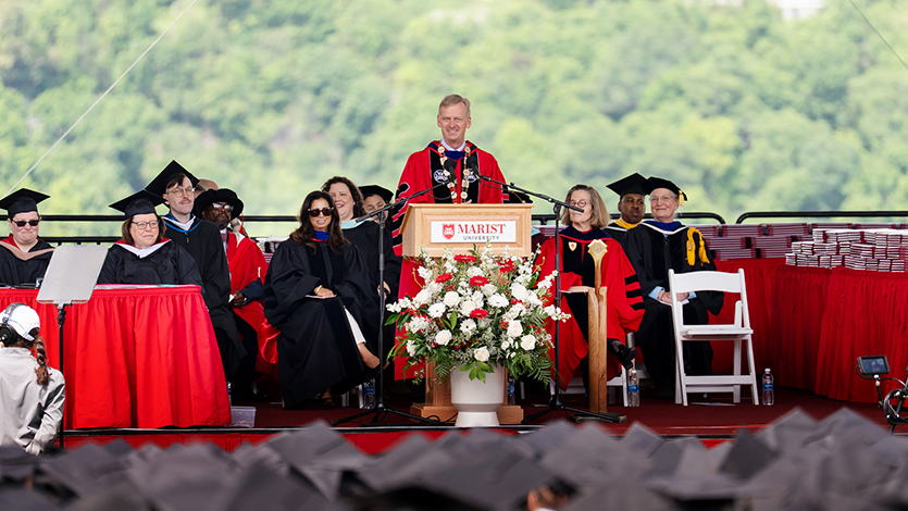 Image of President Weinman addressing graduates.