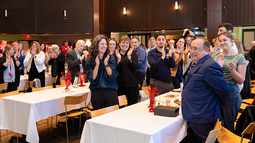 Image of Event attendees give Lee Miringoff, director of the Marist Institute for Public Opinion, a standing ovation for his 50 years of service. Photo by Nelson Echeverria/Marist University.