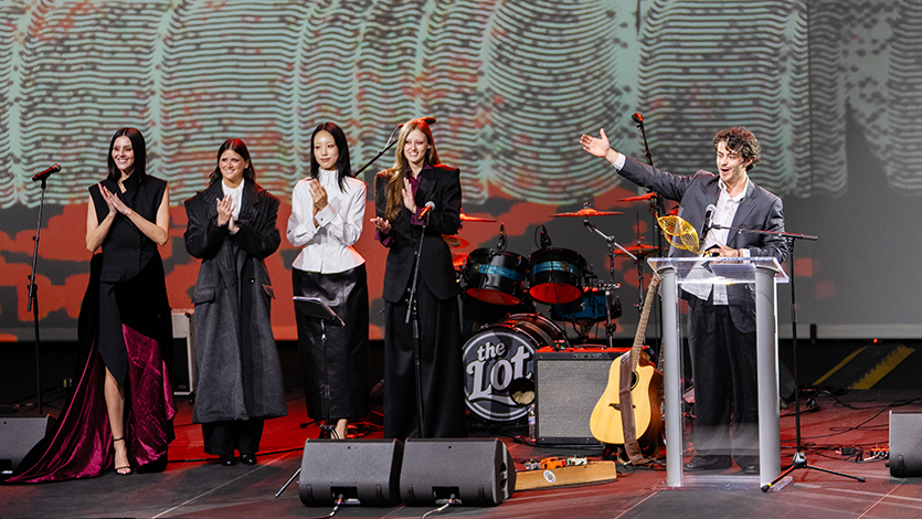 Image of Oskar Villaseñor ’26, Silver Needle Designer of the Year Awardee, with models (left) showcasing his Omitted collection. Photo by Nelson Echeverria/Marist University.