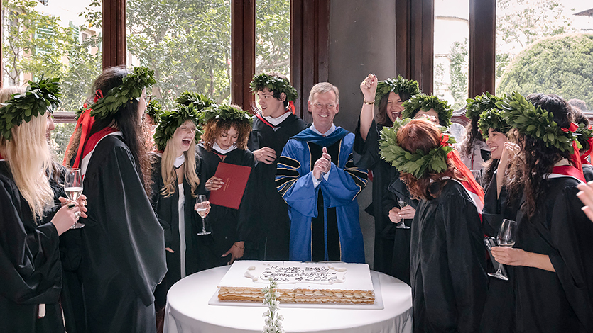 Image of President Weinman celebrating with Marist Italy graduates.