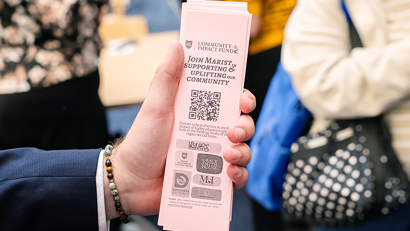 Image of A Community Impact Fund bookmark with donation information, distributed by students during the launch event. Photo by Nelson Echeverria/Marist University.