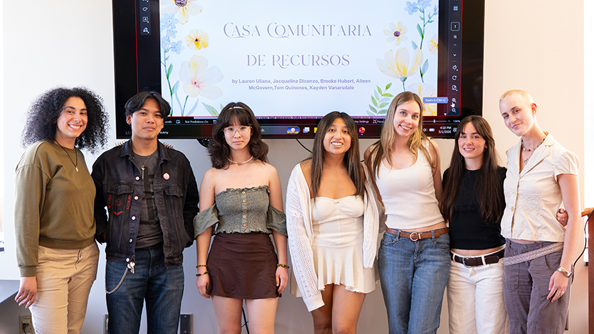 Image of &nbsp;From left to right: Amy Ghattas poses with Tom Quinones ’28, Kayden Vanarsdale ’27, Jacqueline Dicenzo ’28, Lauren Uliana ’26, Aileen McGovern ’27, and Brooke Hubert ’28 in front of their presentation. Photo by Benson Delaney ‘27/Marist University.
