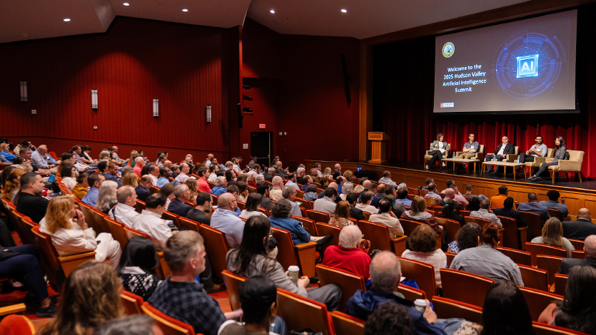 Image of 2025 AI summit in the Nelly Goletti Theatre.