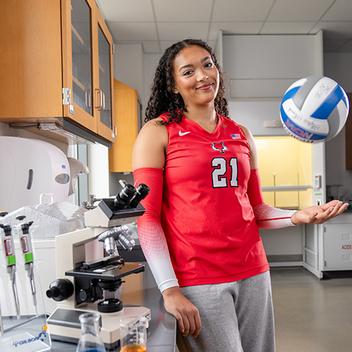Marist University image: Vallena Sneva tossing a volleyball.