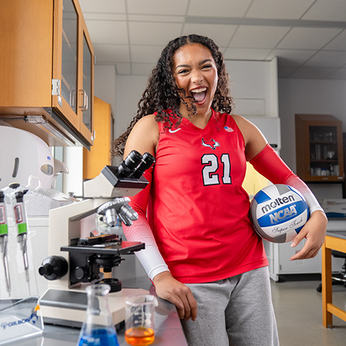 Marist University image: Vallena Sneva holding a volleyball.
