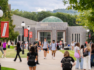 Image of a Marist University campus beauty photo of the rotunda with students in the foreground.