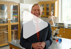 Image of Marist University President Doctor Kevin Weinman in a science lab delivering a message about a $100 million investment in science and health.