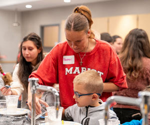 Image of Marist University students facilitating a workshop in the teaching methods lab.