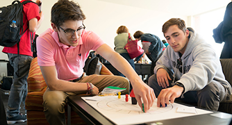 image of two students playing a board game