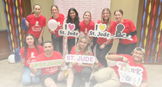 image of students holding st. jude's signs