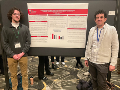 Image of student and faculty member presenting research at the Eastern Psychological Association.