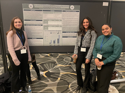 Image of student and faculty member presenting research at the Eastern Psychological Association.