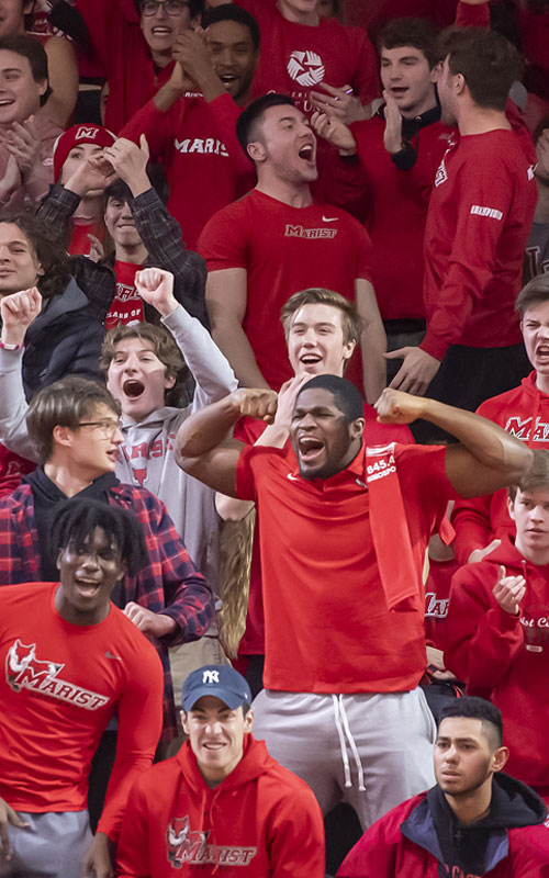 Image of students supporting their peers at a Marist basketball game.
