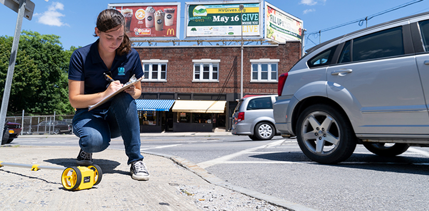 This is a photo of a Tarver Intern working in a street